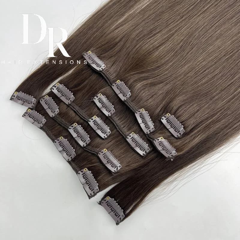 Brown blended DR clip-in pieces arranged with their metal clips visible